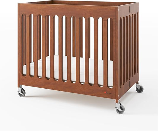 Foundations Boutique Folding Mini Baby Crib - Compact, Portable, Wooden Hotel Crib, Foldable Compact Cribs for Baby & Toddlers - Includes 3" Foam Mattress - Cherry