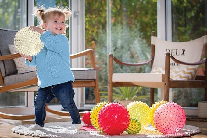Edushape The Original Sensory Ball for Baby - 7" Glow-in-The-Dark Color Baby Ball That Helps Enhance Gross Motor Skills for Kids Aged 6 Months & Up - Vibrant, Colorful & Unique Toddler Ball